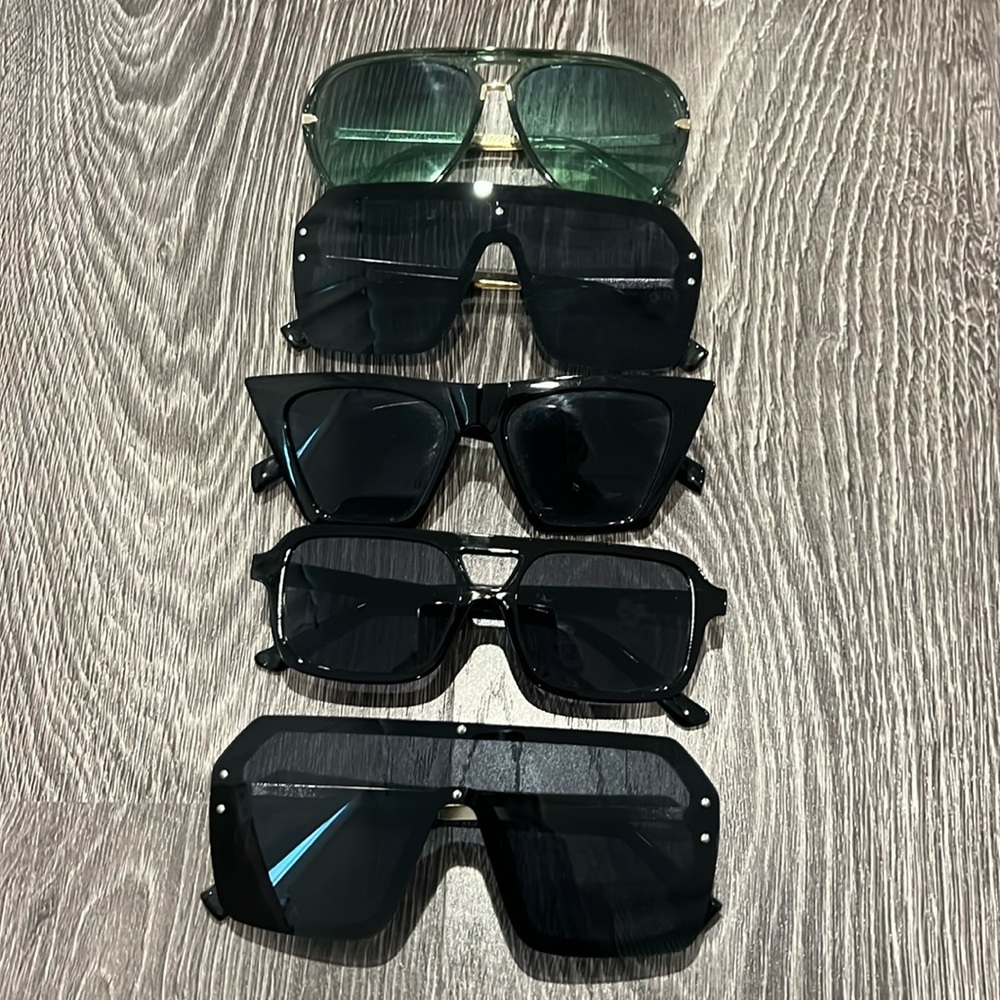 Bundle of 5 pairs of sunglasses. Never worn. Just collecting dust!
